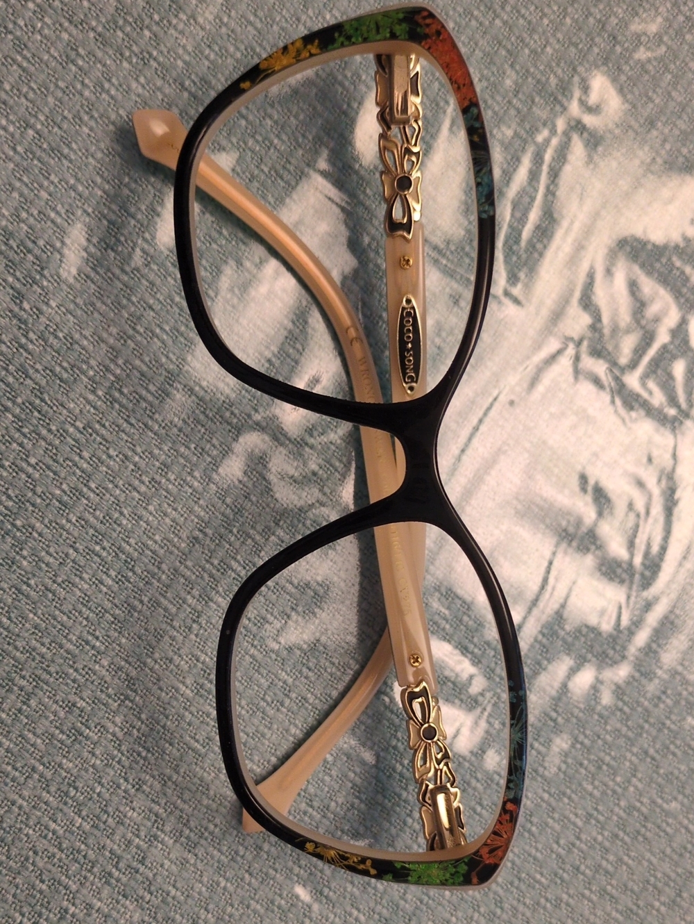 Elegant Black Front Glasses with Cream Temples and Floral Trim